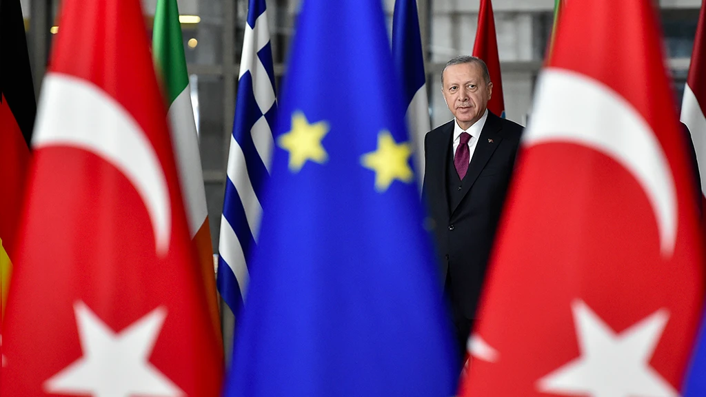 Turkish President Recep Tayyip Erdogan EU flag and other nation states along with Turkish flag