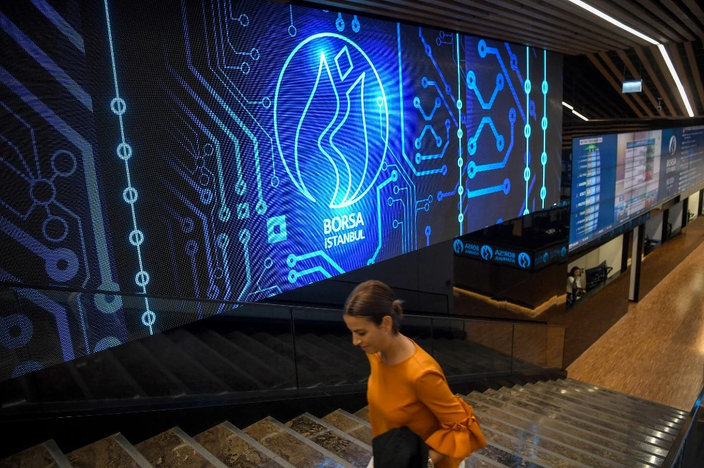 A trader walks in the trade floor of the Borsa Istanbul