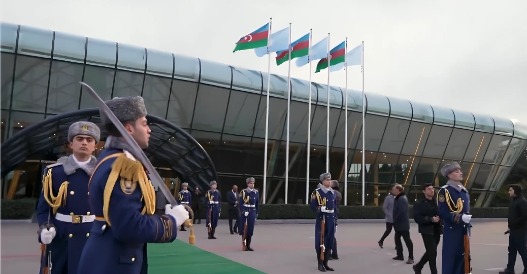 Azerbaijani soldiers at an official ceremony with Somalia and Azerbaijan flags in background