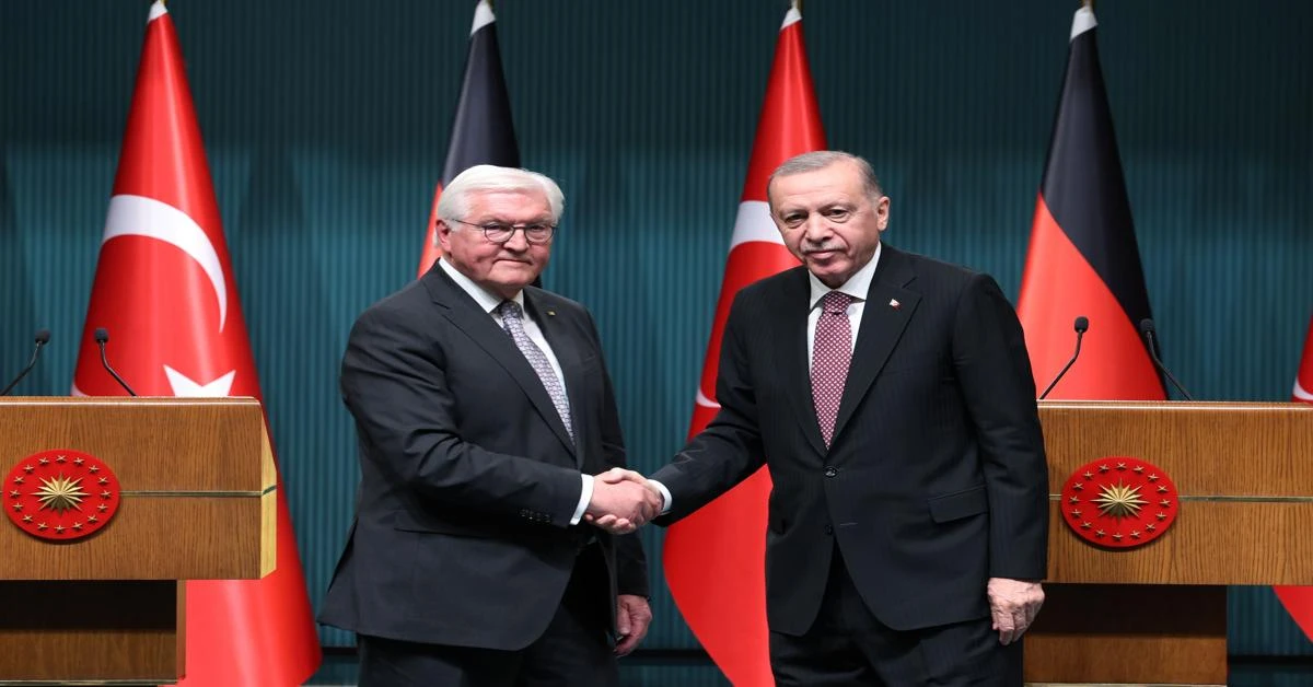 Photo shows Turkey's President Erdogan and German President Frank-Walter Steinmeier shaking hands.