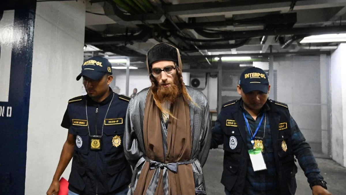 Yoel Alter, leader of Lev Tahor, is escorted by Interpol officers following his arrest for child abuse and human trafficking in Guatemala on January 29, 2025.