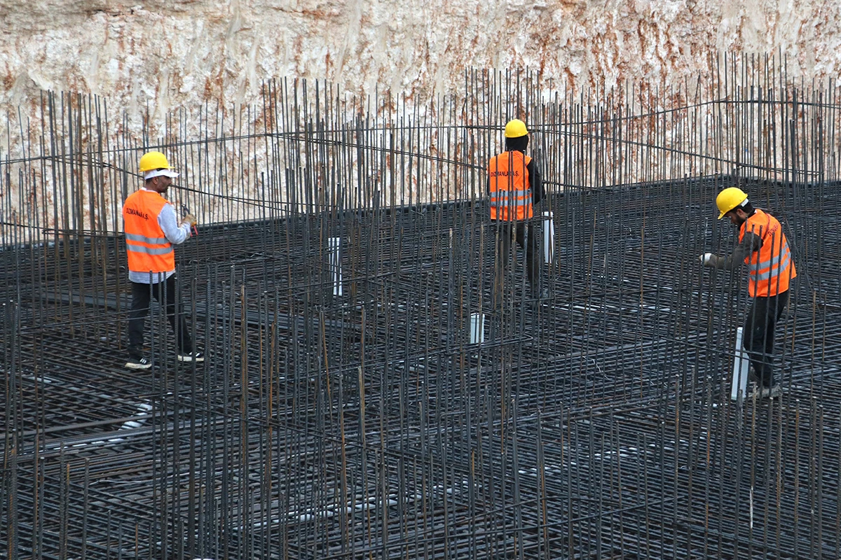 Photo shows Turkish construction workers working