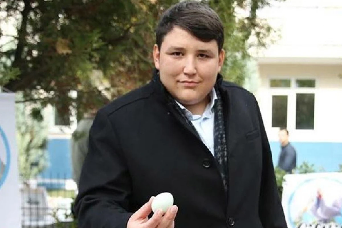 Mehmet Aydin, the founder of the Ponzi scheme Ciftlik Bank, is seen here holding an egg