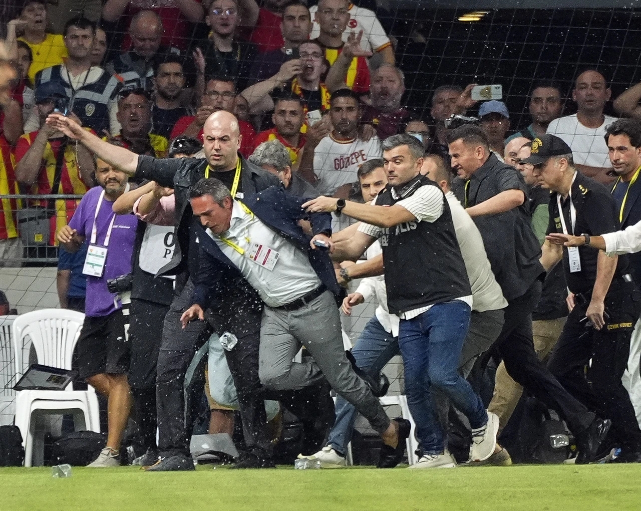 Turkish match turns violent as Fenerbahce's president is pushed off the pitch