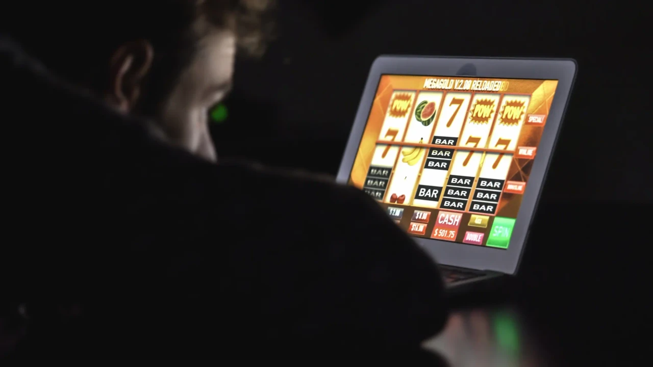 A person looking at screen for online betting