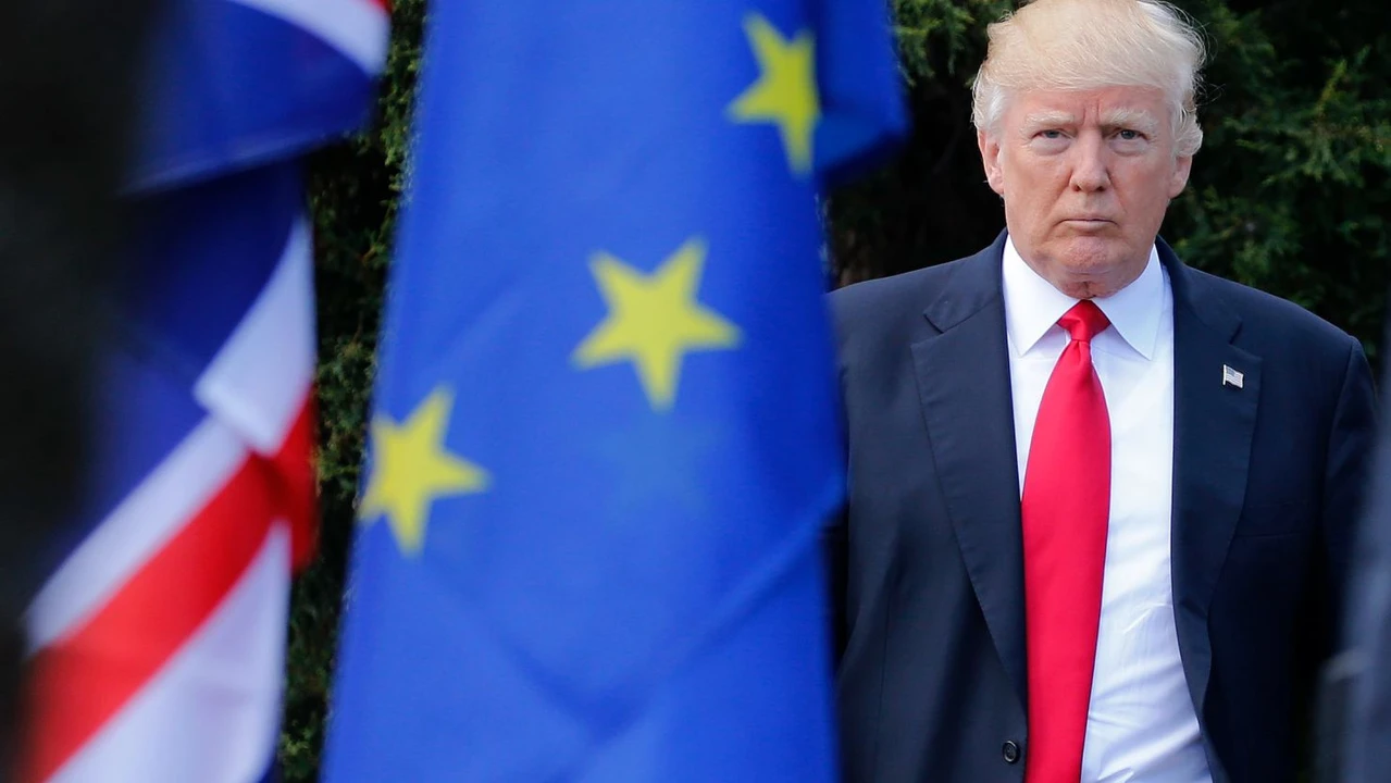 Photo shows Donald Trump standing next to an European Union Flag