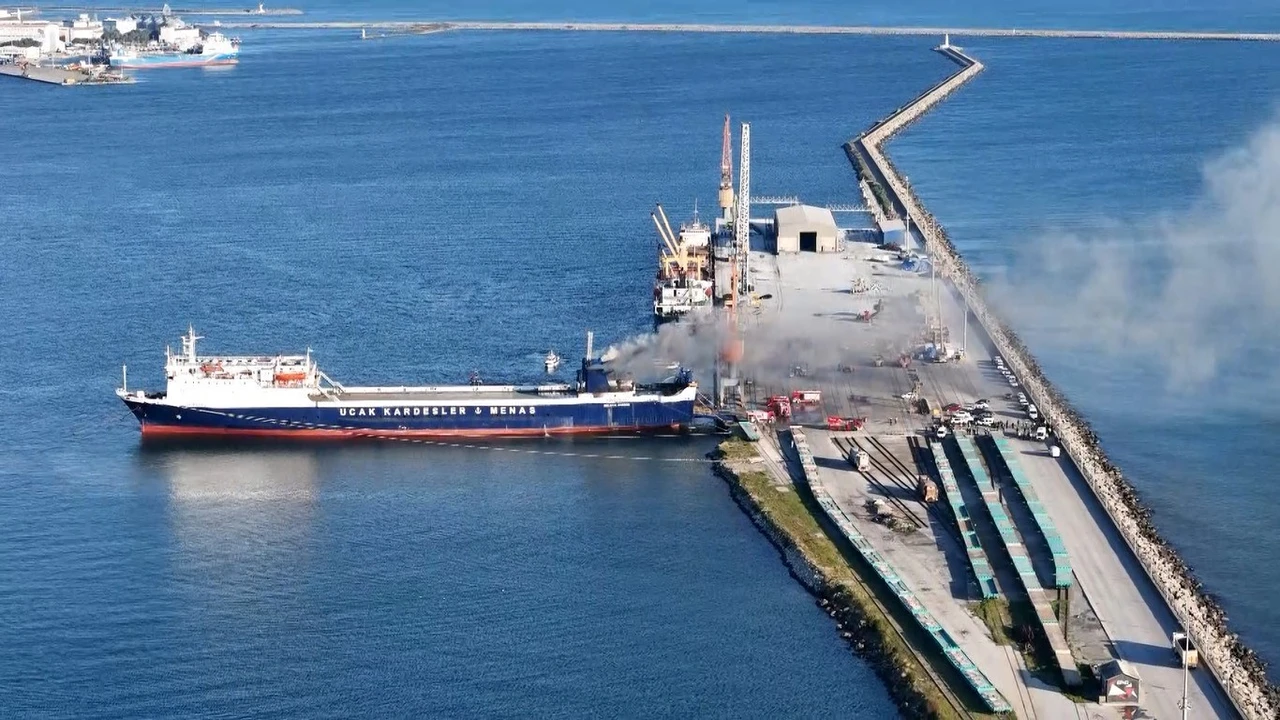 Aerial view of a fire on a ship at Samsun Port, controlled by response teams