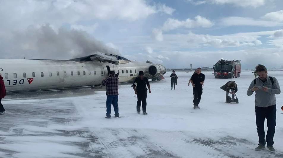 Delta plane flips over during landing at Toronto airport, leaving eight
