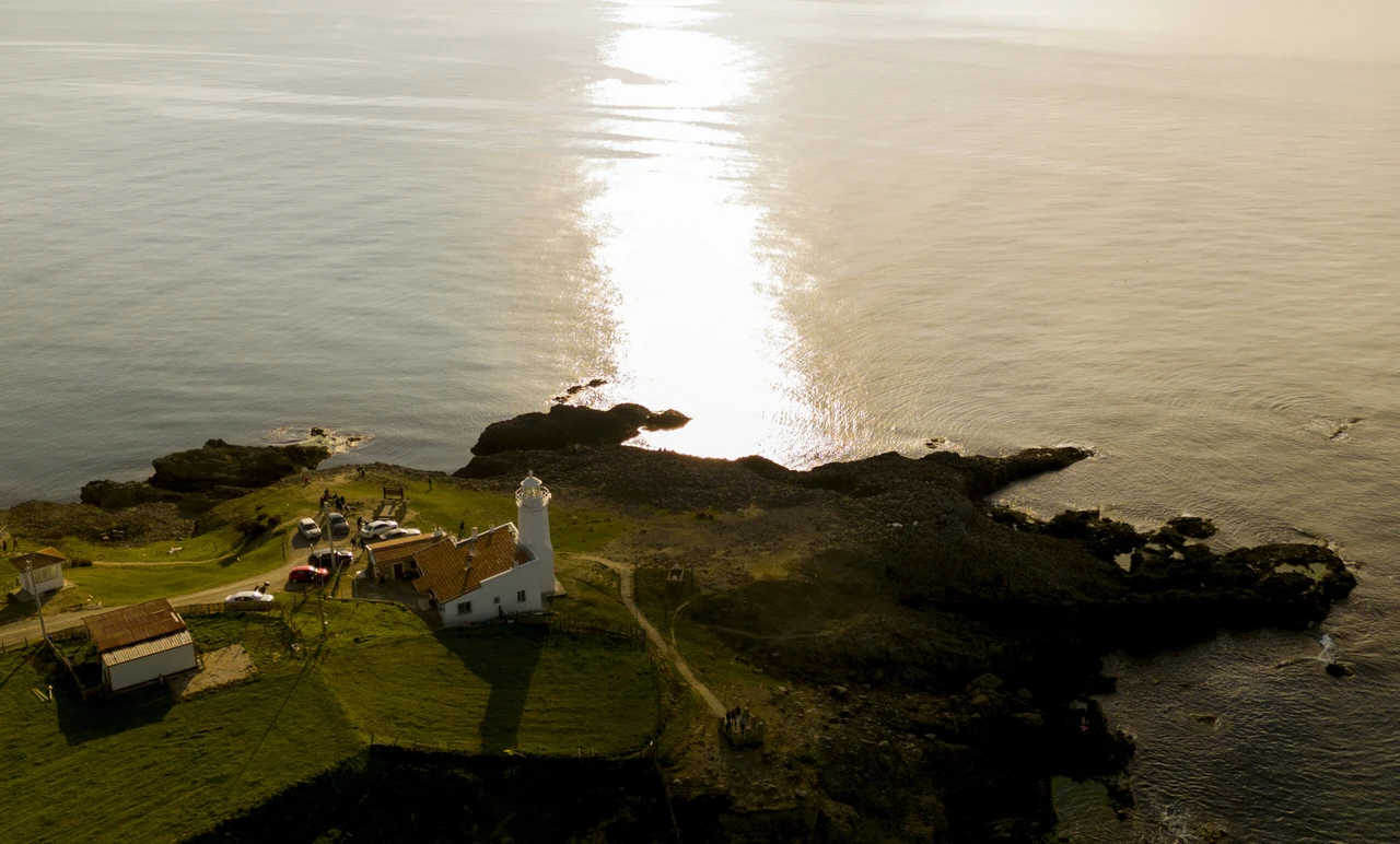 Aerial view of the 161-year-old Inceburun Lighthouse on Sinop's Inceburun Peninsula, Türkiye's northernmost point, continuing to guide sailors.