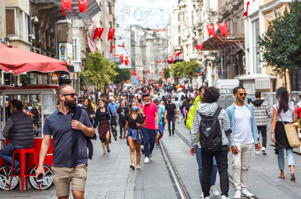 People walk along Istiklal Avenue