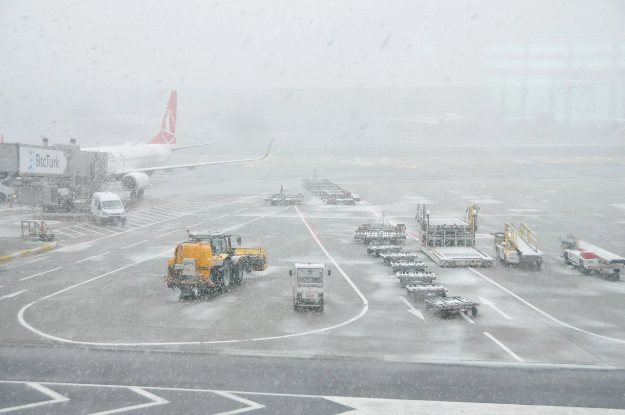 Snowfall in Istanbul leads to reduced flights and snow-covered Istanbul Airport.