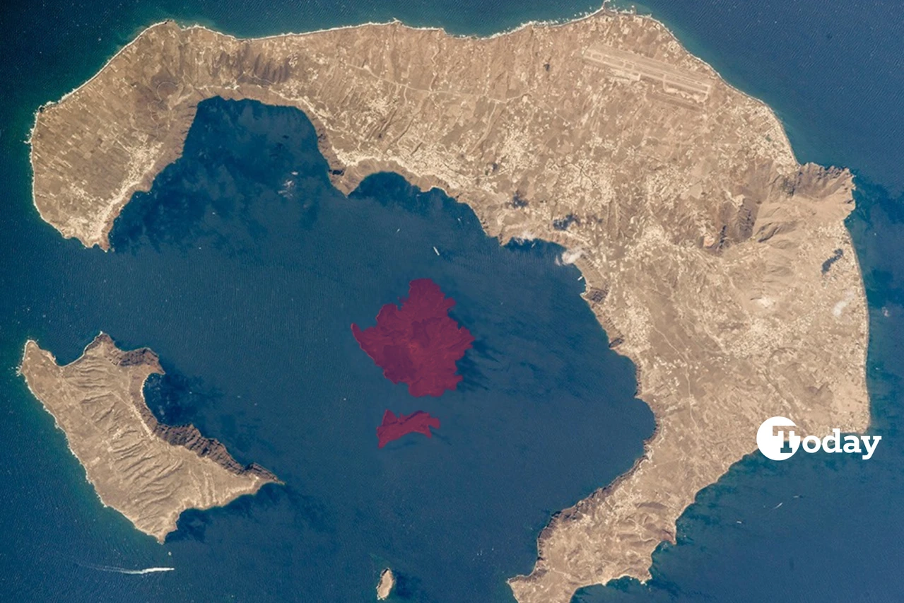 A satellite image of the Santorini volcano's underwater caldera, with the central lagoon surrounded by islands, including Santorini.