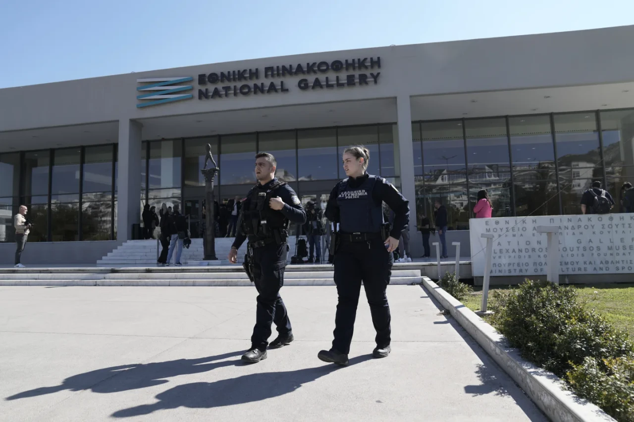 Greek police officers outside the National Gallery in Athens following the detention of MP Nikolaos Papadopoulos for allegedly attacking artworks at an exhibition.