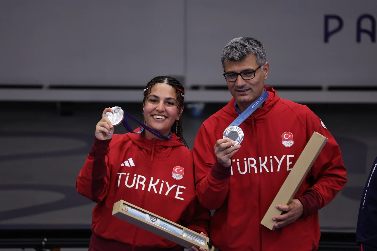 Photo shows Turkish shooter Yusuf Dikec and Sevval Ilayda Tarhan holding their silver olympic medals