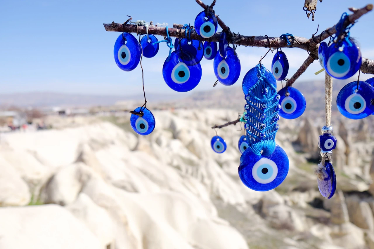 Evil eye charms hang from a tree in Cappadocia