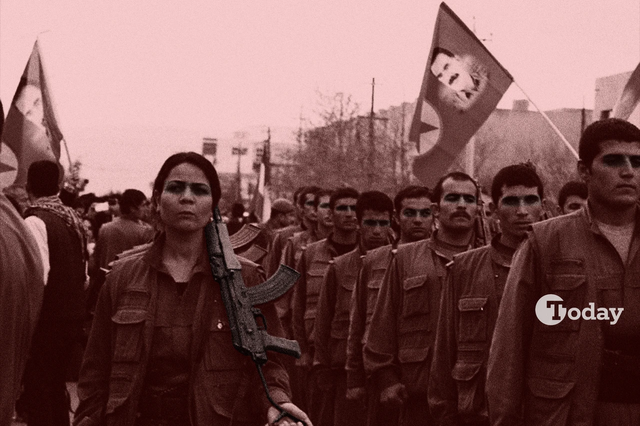 PKK members with a flag depicting the image of PKK's ringleader Abdullah Ocalan