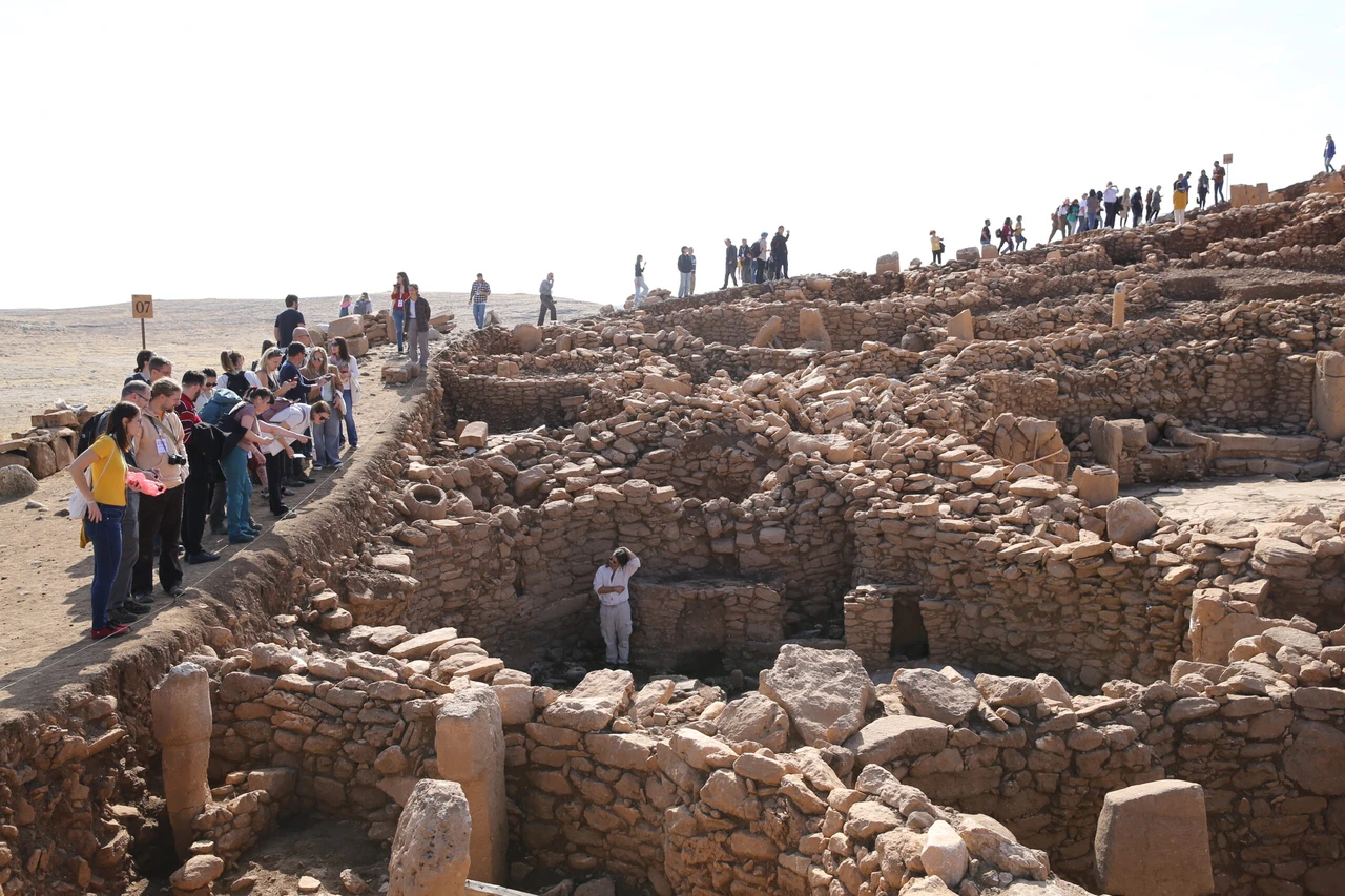 Scholars and researchers attending the World Neolithic Congress explore Karahantepe, an important archaeological site in Sanliurfa, Türkiye, on November 6, 2024.