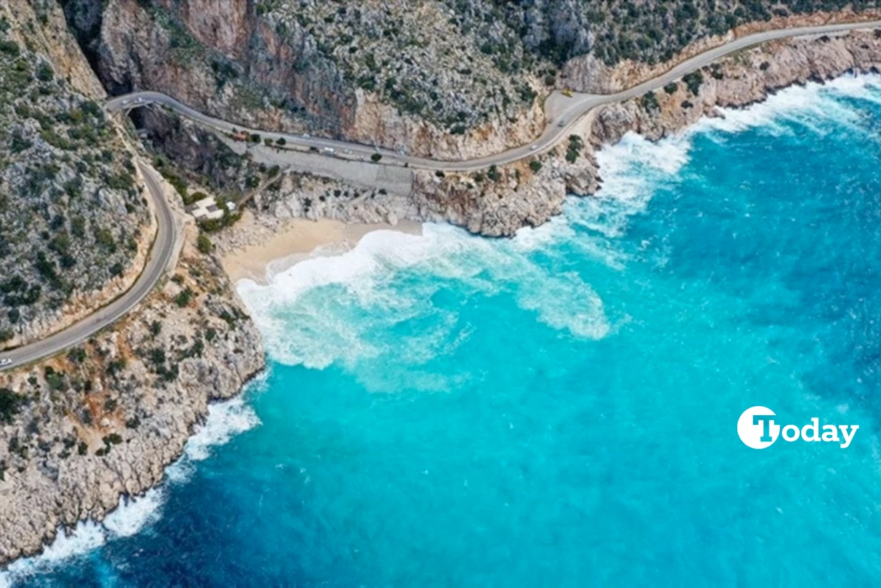 Aerial view of Kas' Kaputas Beach with turquoise waters and a winding coastal road