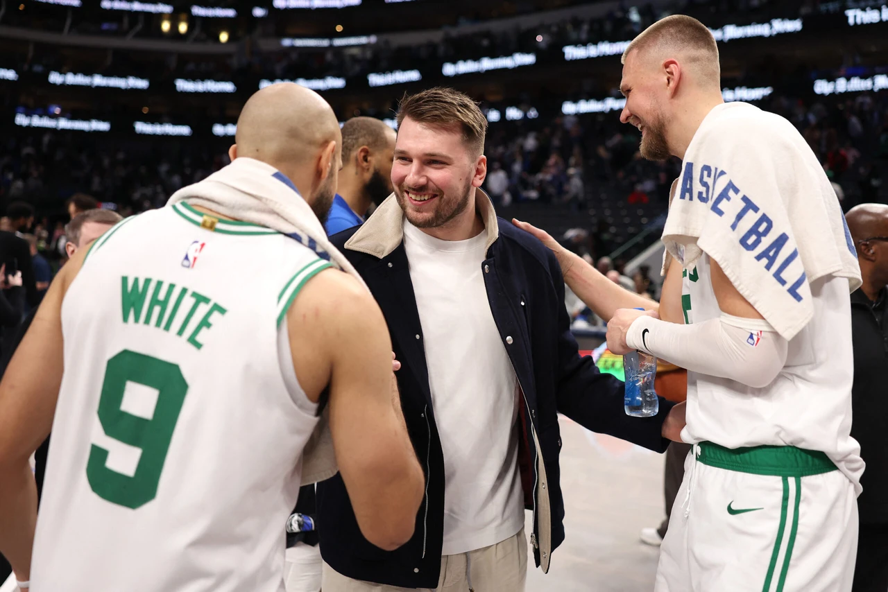 Luka Doncic heads to Lakers as Mavericks acquire Anthony Davis in three-team trade 2 Photo shows Luka Doncic of the Dallas Mavericks talking with his teammates