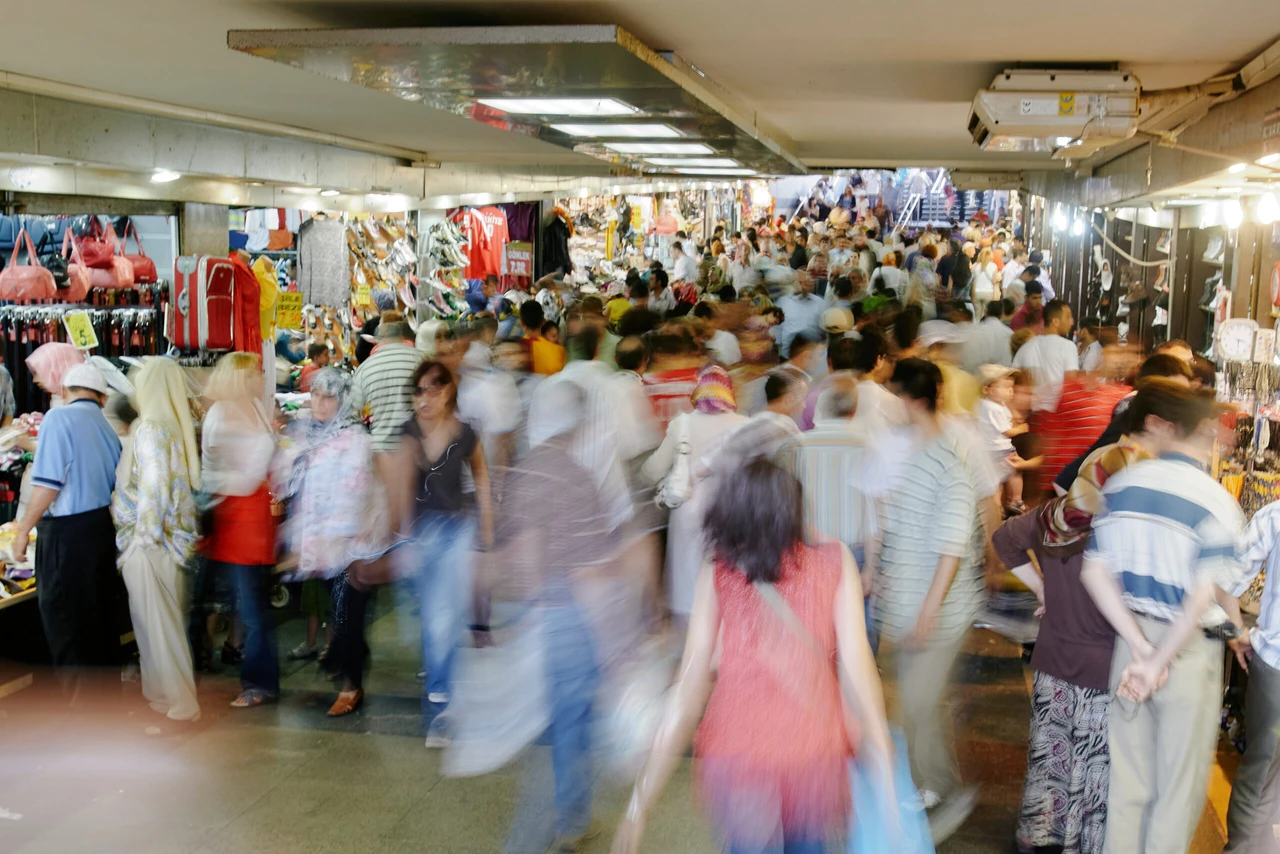 Crowds fill an underground shopping market