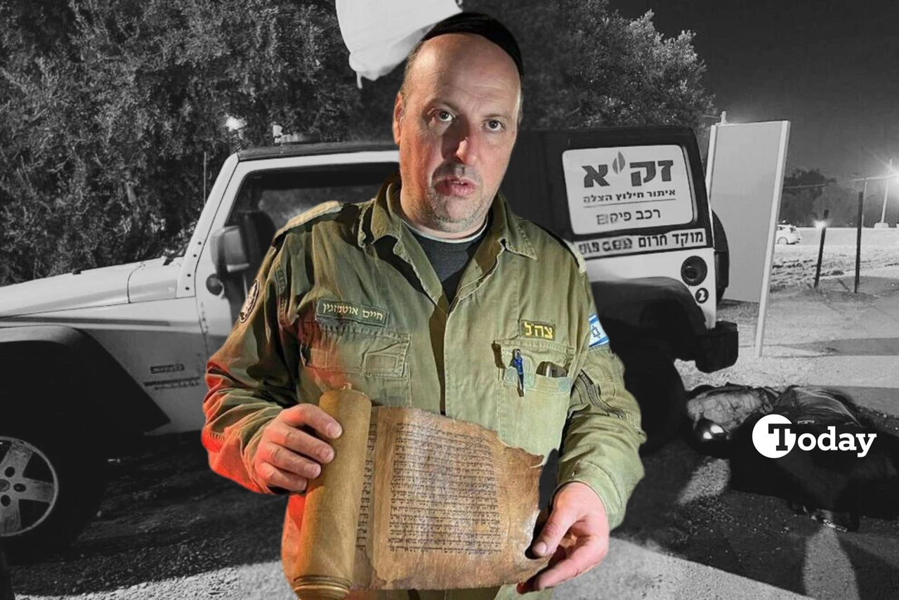 Major Haim Otmazgin, an Israeli ZAKA volunteer, holding the ancient Book of Esther scroll smuggled from Türkiye to Israel.