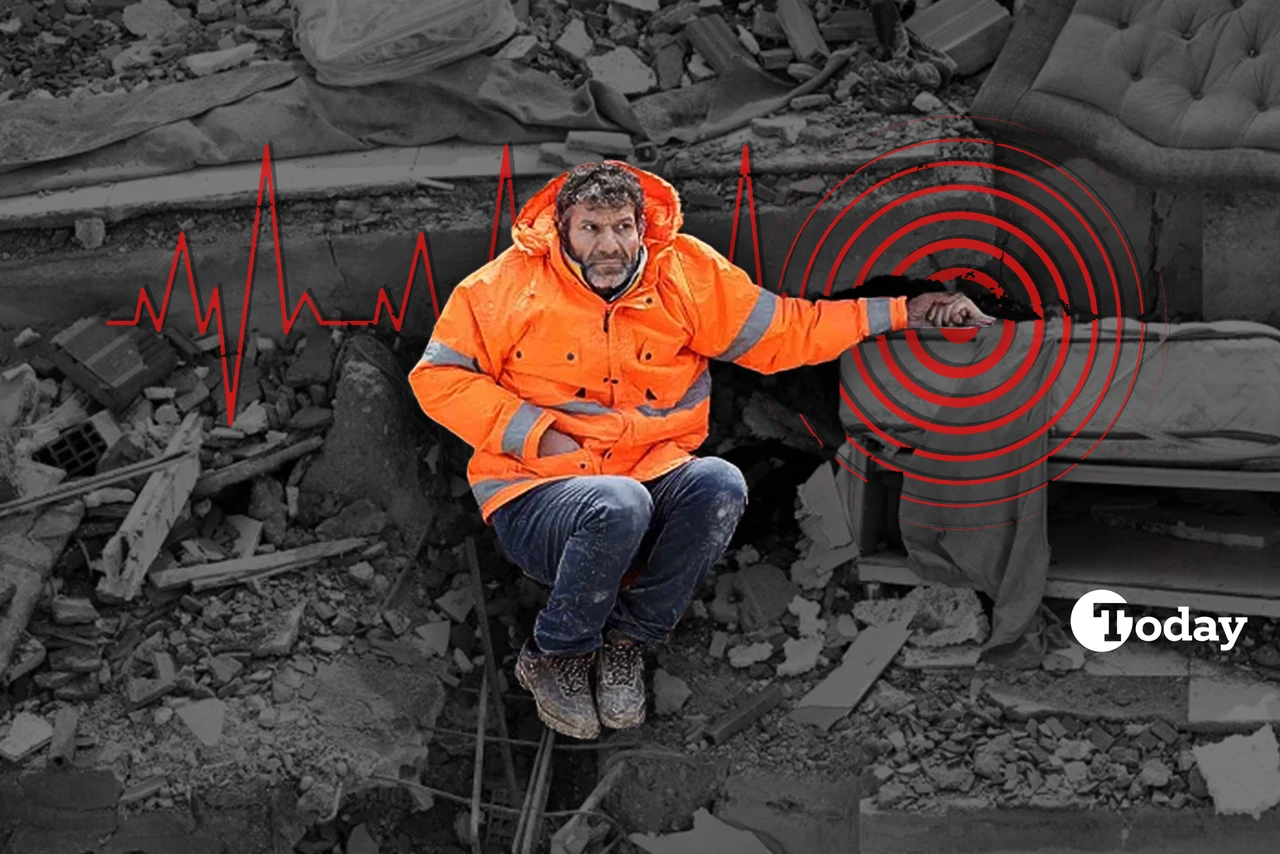 A man after the earthquake holding the hand of his loved one under the rubbles