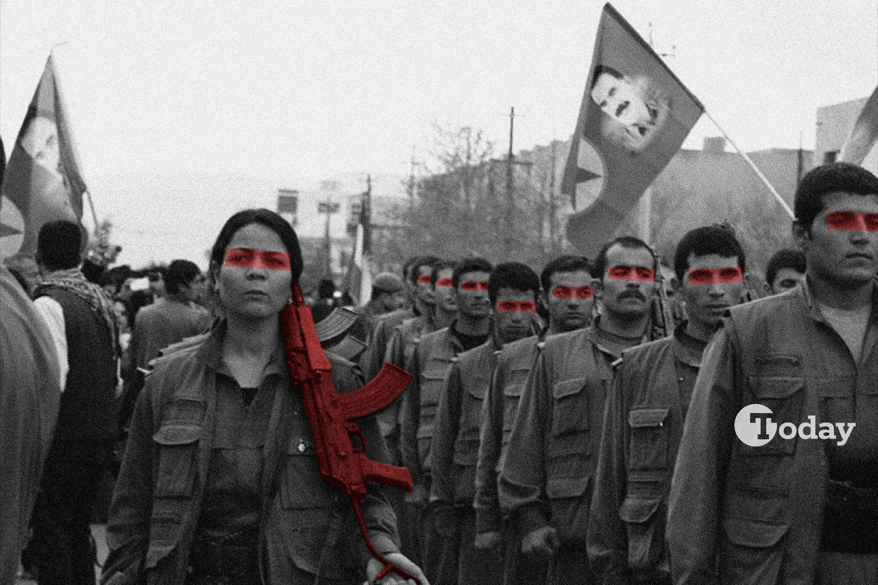 PKK members with a flag depicting the image of PKK's ringleader Abdullah Ocalan