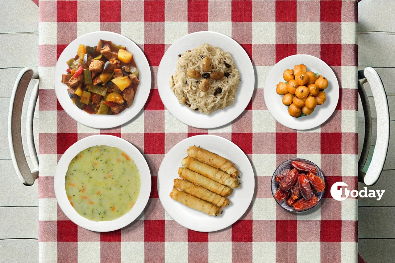 A table set with a variety of traditional Turkish dishes for iftar, including lamb stew, rice pilaf, fried rolls, and lokma.