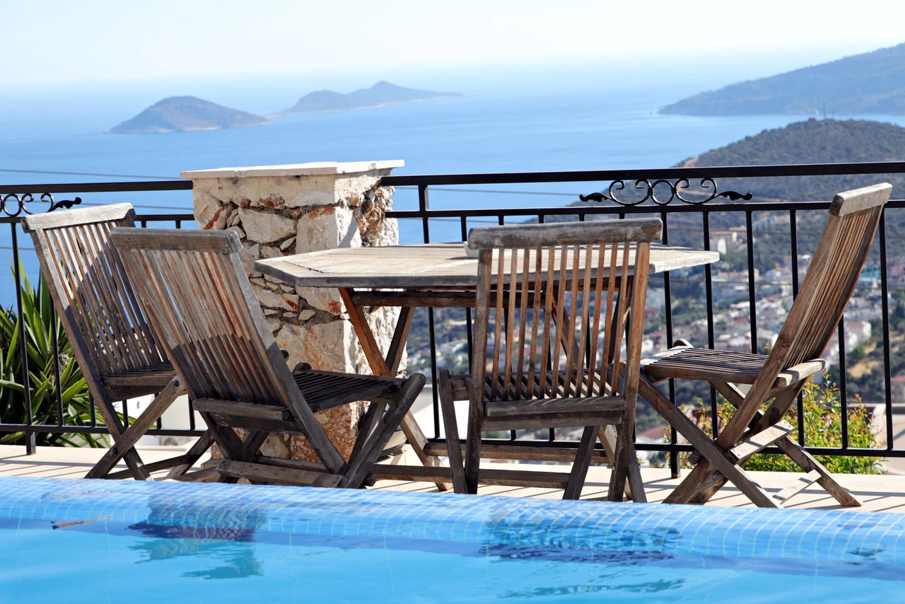 Stunning sea view and wooden seating in the garden in a villa in Antalya's 'Kas' district