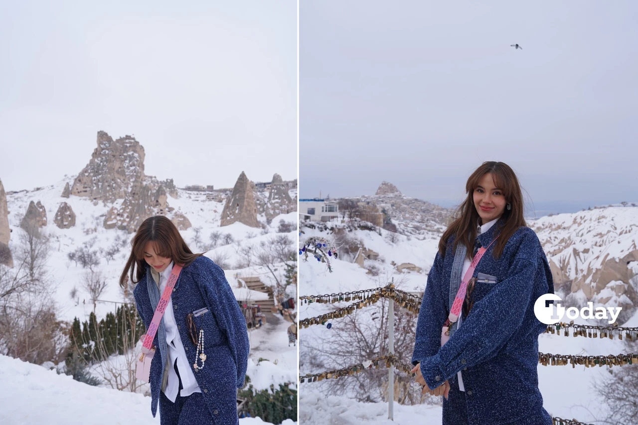 Catriona Gray posing in the snow with fairy chimneys in Cappadocia