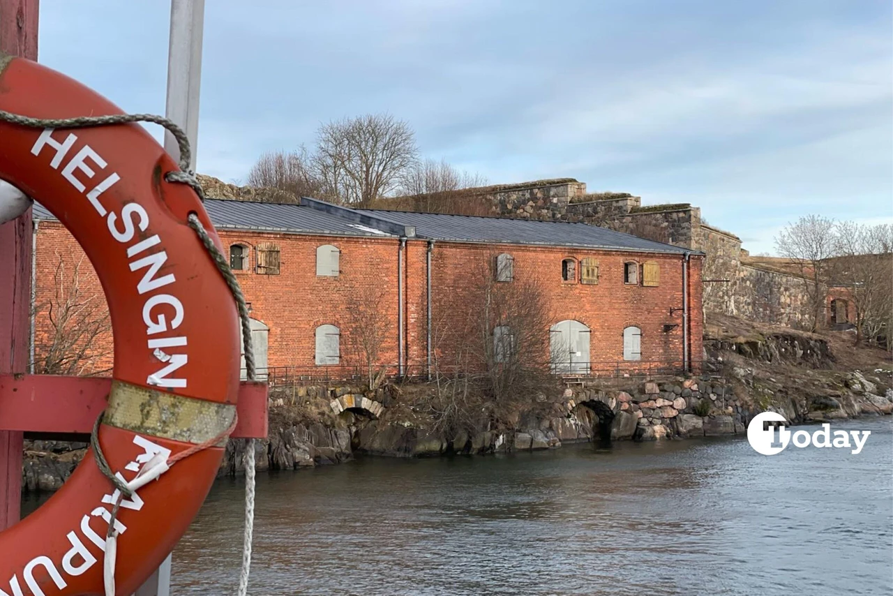 Colorful traditional houses on Suomenlinna Island, Finland, with a peaceful winter atmosphere.