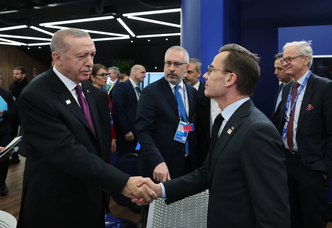 Turkish President Recep Tayyip Erdogan (L) seen shaking hands with NATO Secretary General Mark Rutte.