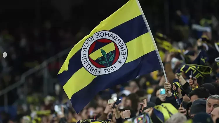 The image shows a Fenerbahce flag waving