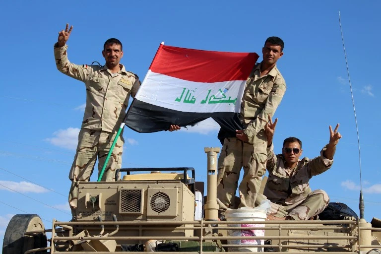 Iraq says to begin repatriating Syrian troops who fled offensive