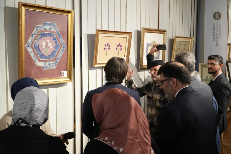 A visitor observes artwork at the "Tradition to Future: Turkish Islamic Arts Exhibition" at the DITIB General Center in Cologne, Germany, on January 24, 2025.