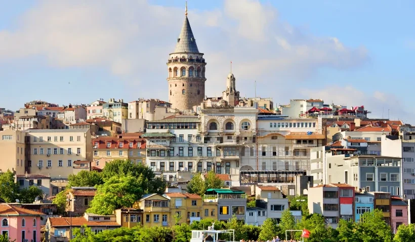 A breathtaking view of Galata Tower, one of the world's oldest towers and an iconic symbol of İstanbul, Türkiye, standing tall against the city skyline.