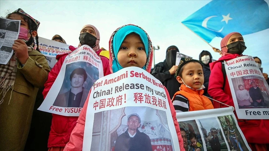 Photo shows uyghur child holding a anti china protest banner