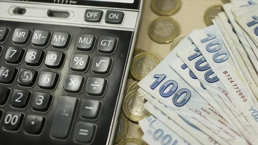 File photo shows a close-up image of a calculator alongside Turkish banknotes.