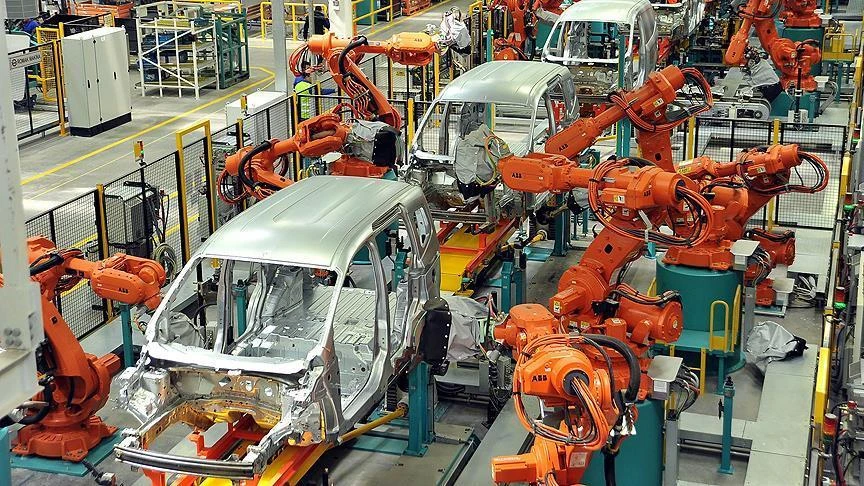 robotic arms assemble vehicle frames on an automated production