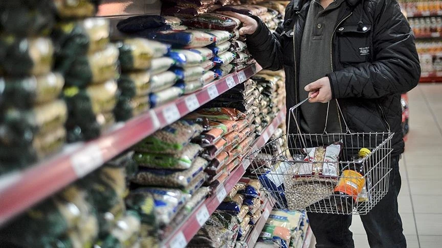 An individual seen shopping in a grocery shop.