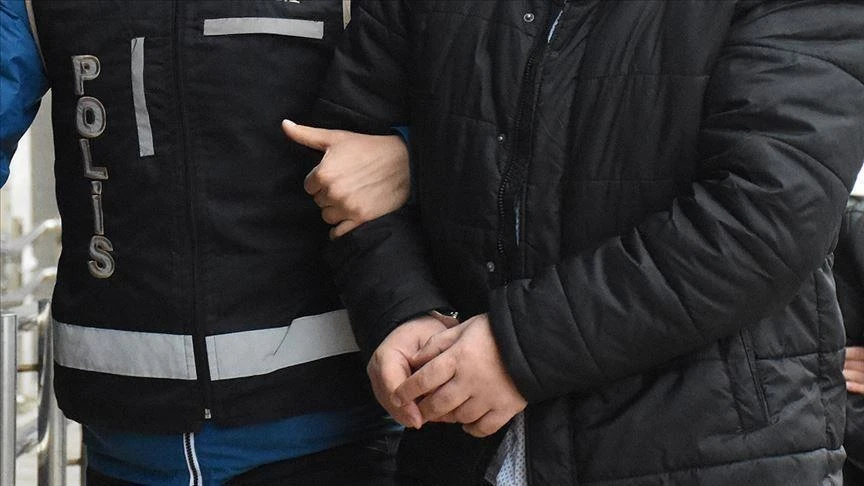 In a FETO operation, a terrorist puts their arm around a police officer's shoulder