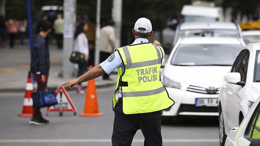 A traffic police stop vehicles at traffic inspection point