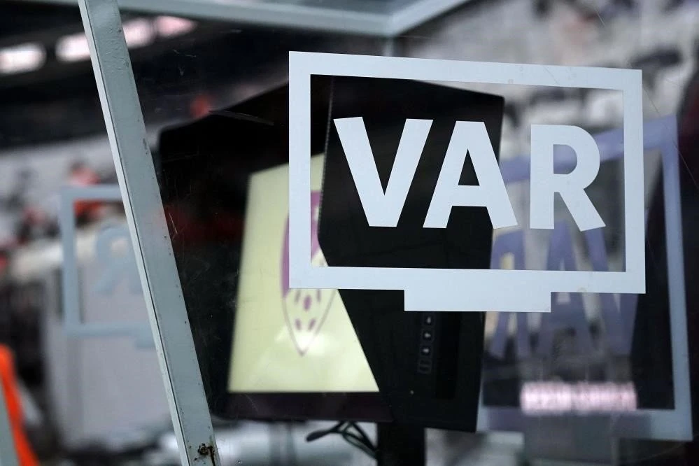 A VAR screen covered by protective glass at a football match.