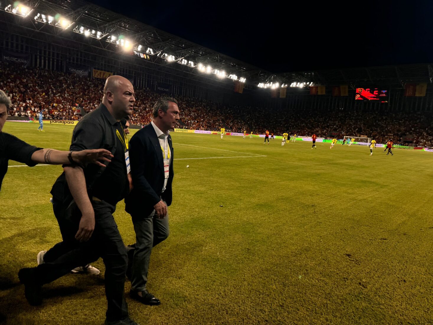 Turkish match turns violent as Fenerbahce's president is pushed off the pitch