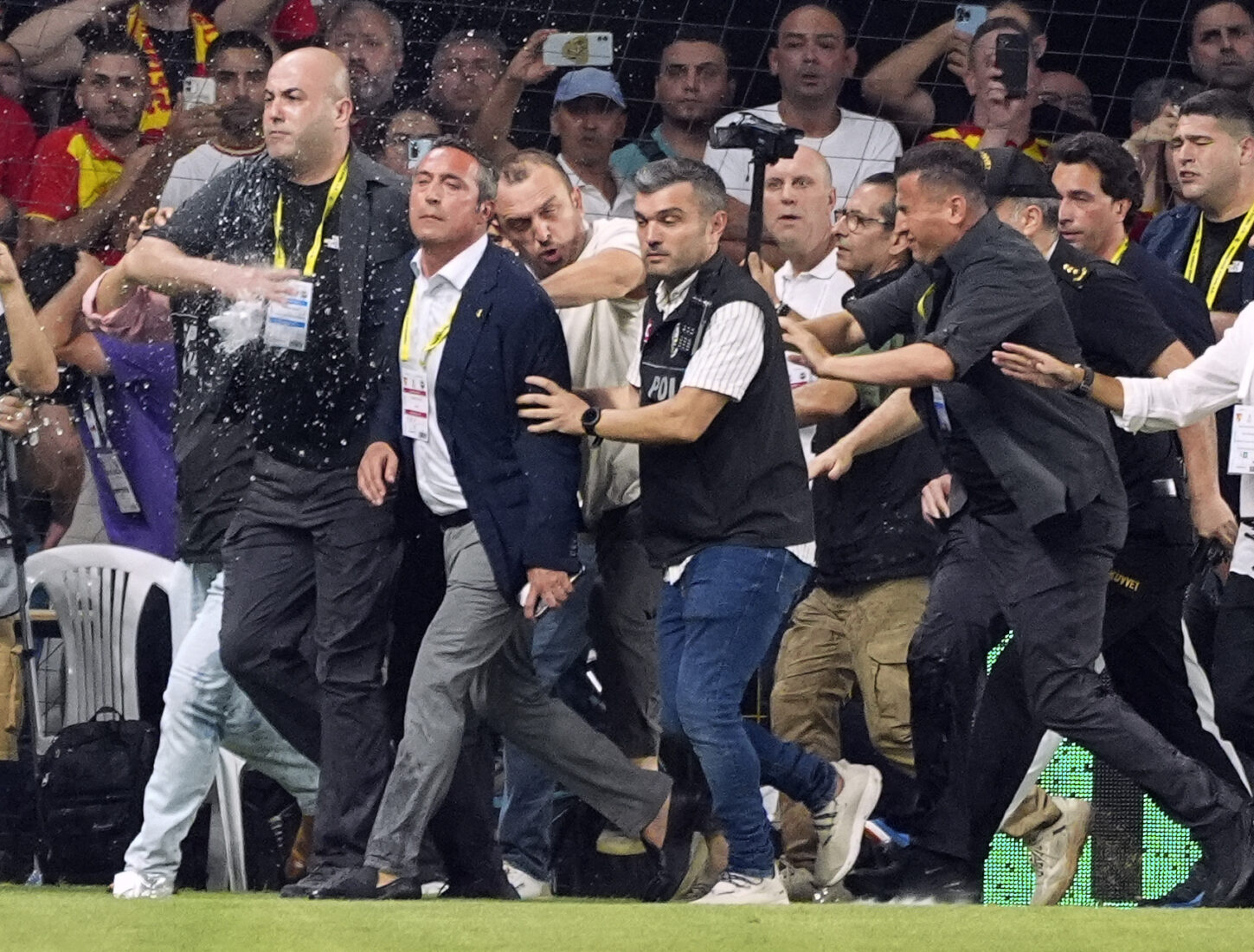 Turkish match turns violent as Fenerbahce's president is pushed off the pitch