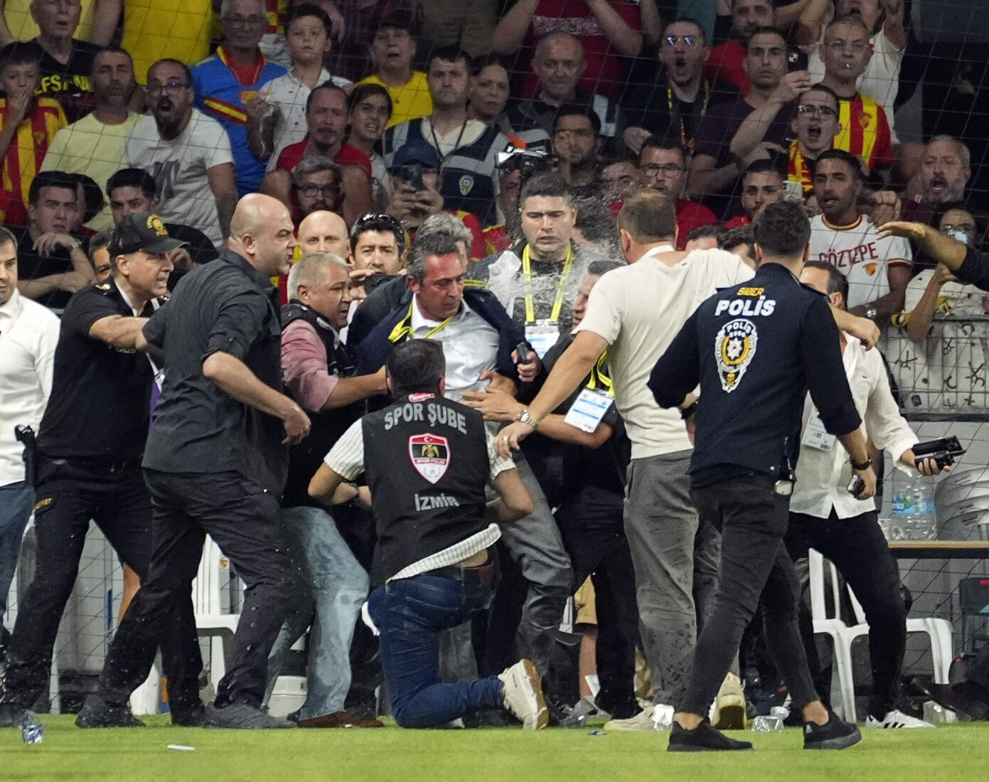 Turkish match turns violent as Fenerbahce's president is pushed off the pitch