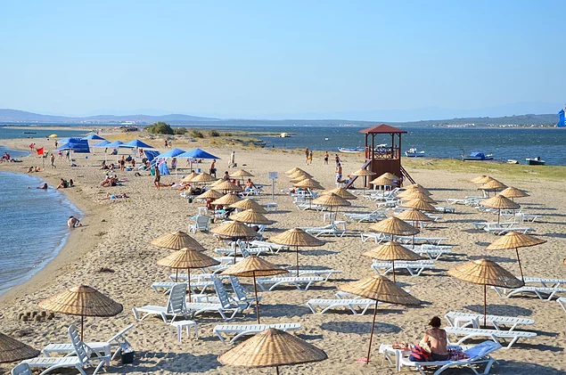 Experience the serene beauty and stunning sunsets of Altınova Beach, a coastal paradise near Ayvalik. 