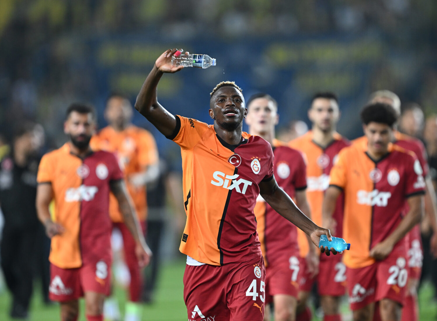 Victor Osimhen (45) of Galatasaray greets fans as he celebrates his team's victory in the Turkish Super Lig match against Fenerbahce at Ulker Stadium in Istanbul