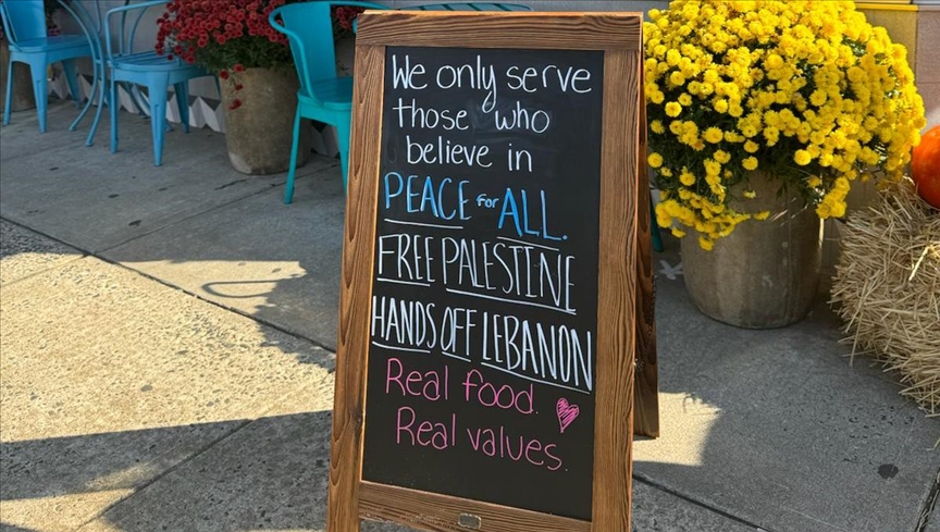 A sign outside Turkish Baklava Lady’s bakery in Englishtown reads, 'We only serve those who believe in peace for all. Free Palestine, hands off Lebanon,' stirring both support and controversy in the community