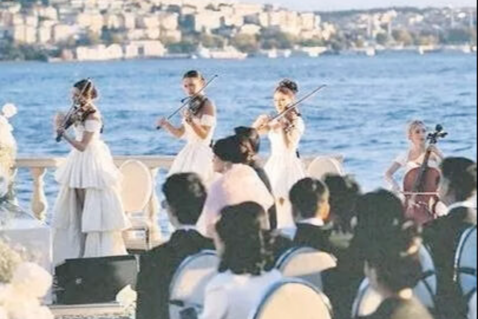 String quartet performs by the Bosphorus at the Tanuri-Tjipto wedding ceremony in Istanbul, Türkiye. wedding on Bosphorus